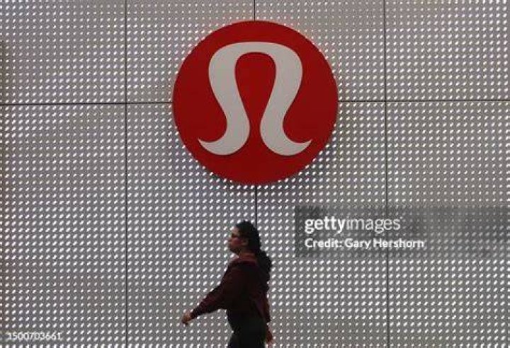 A Lululemon corporate logo hangs on the wall of their store in the Garden State Plaza Mall on November 4, 2023, in Paramus, New Jersey