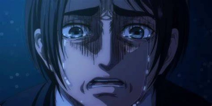 Eren sits in shock in the final episode of the “Attack On Titan” anime