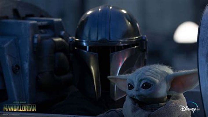 Grogu looks questioningly at Mando.