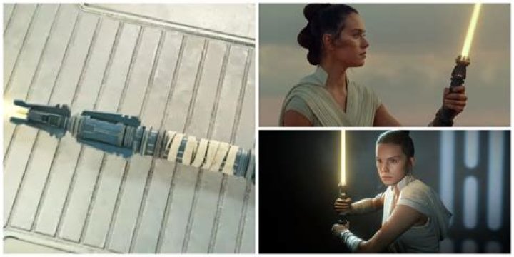 Rey looks at her orange lightsaber